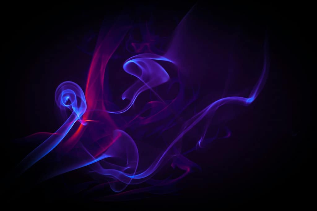 Violet Smoke Swirls on Black Background