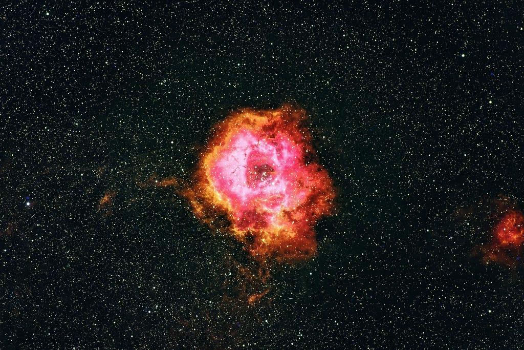 Orange Nebula Clouds Drifting Through Deep Space