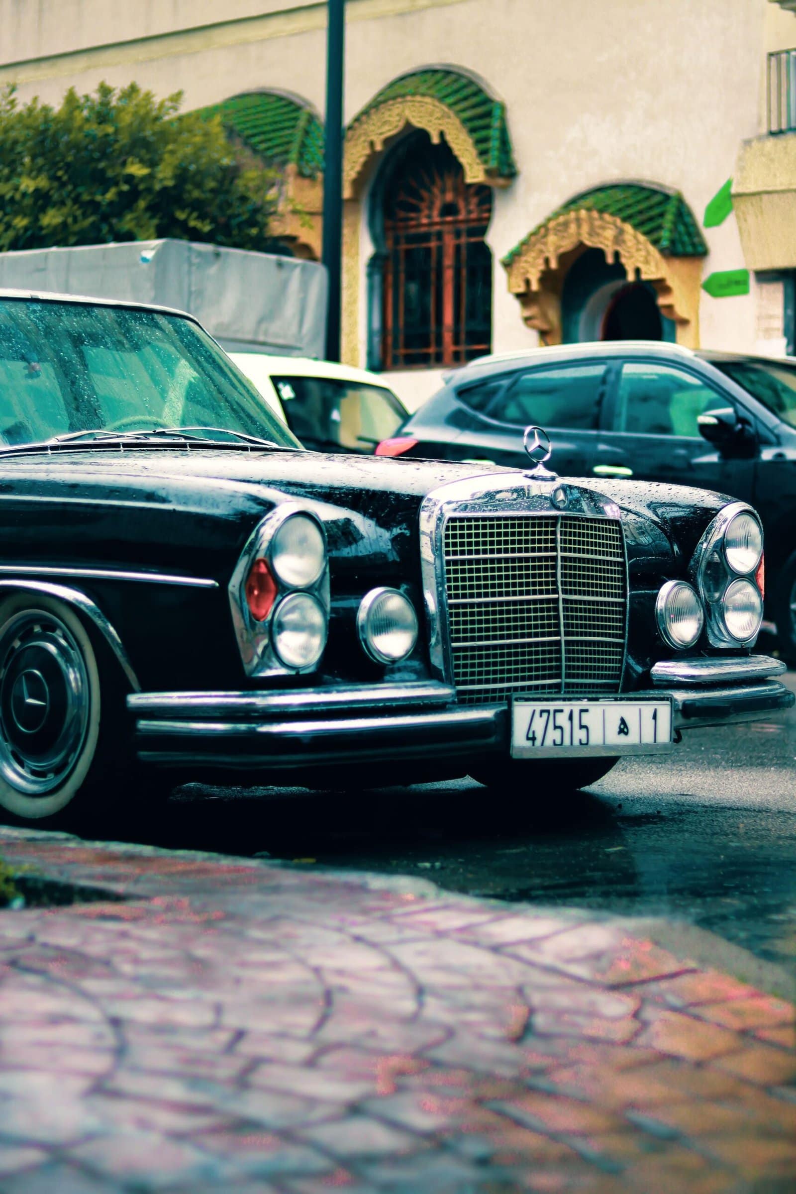Black Classic Car in Rainy City Street