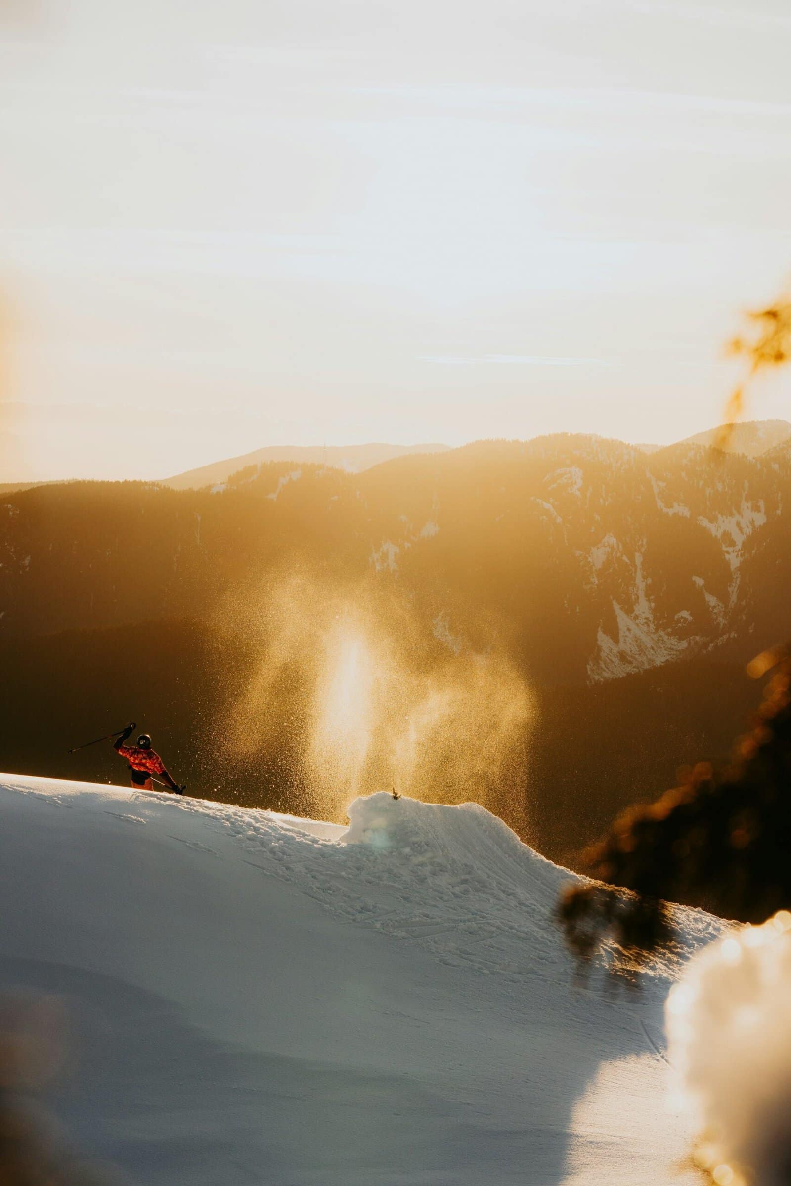 Skier Carving Through Fresh Powder Snow at Sunrise