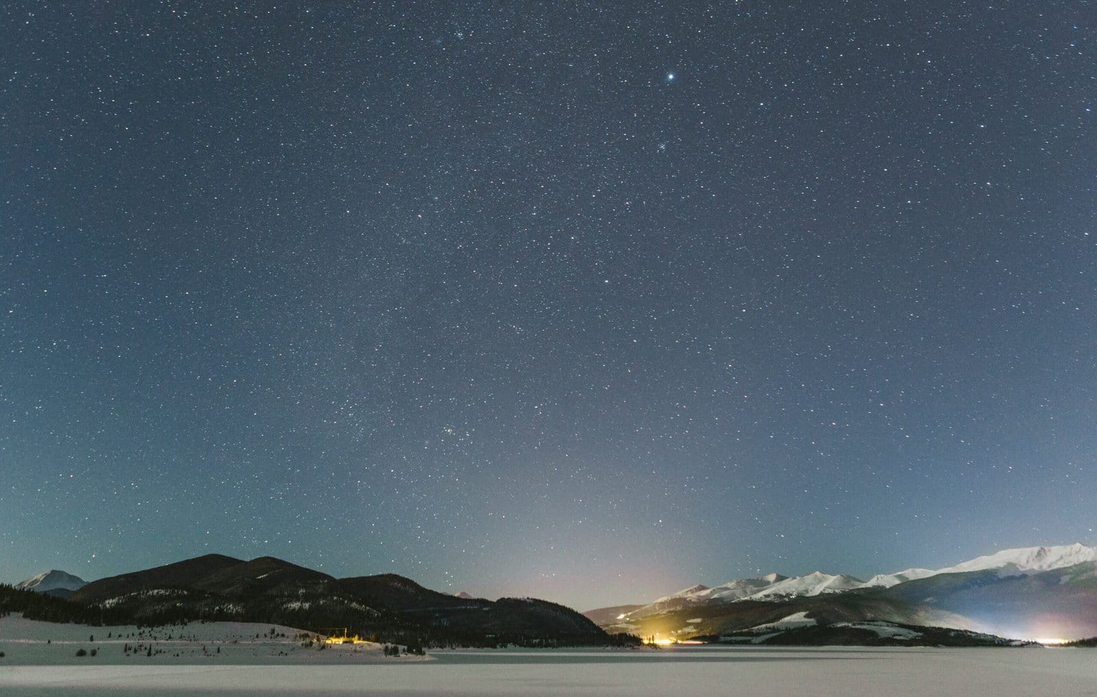 Star Cluster Shining Over Frozen Mountain Lake