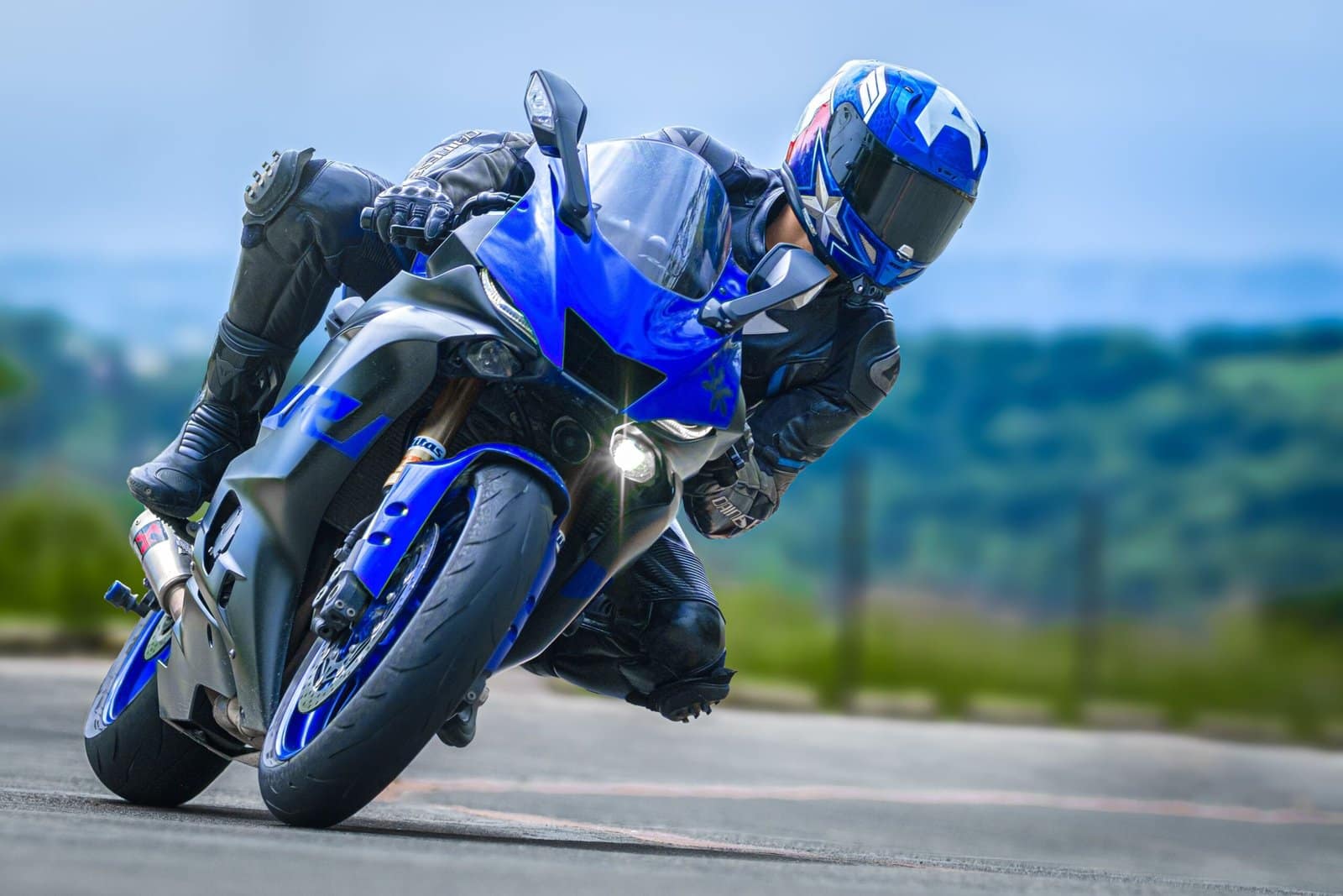 Blue Sport Bike Racing Down an Empty Highway