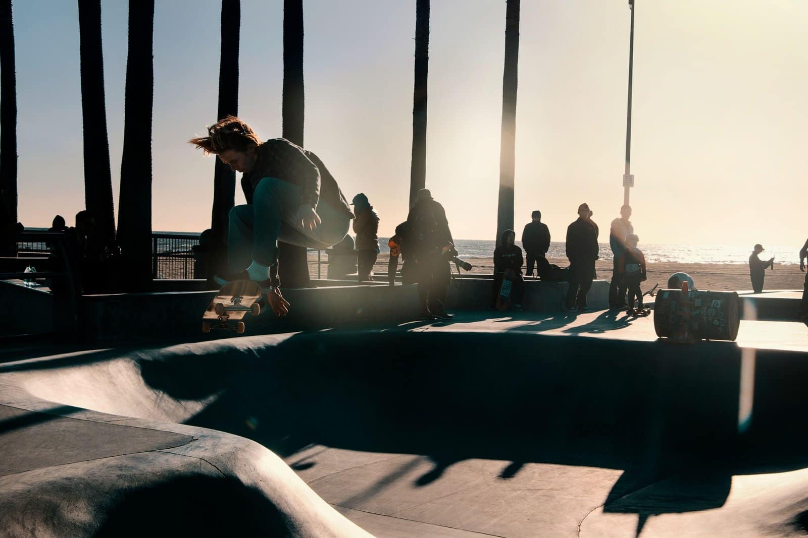 Skateboarder Catching Air Above a Sunset Ramp
