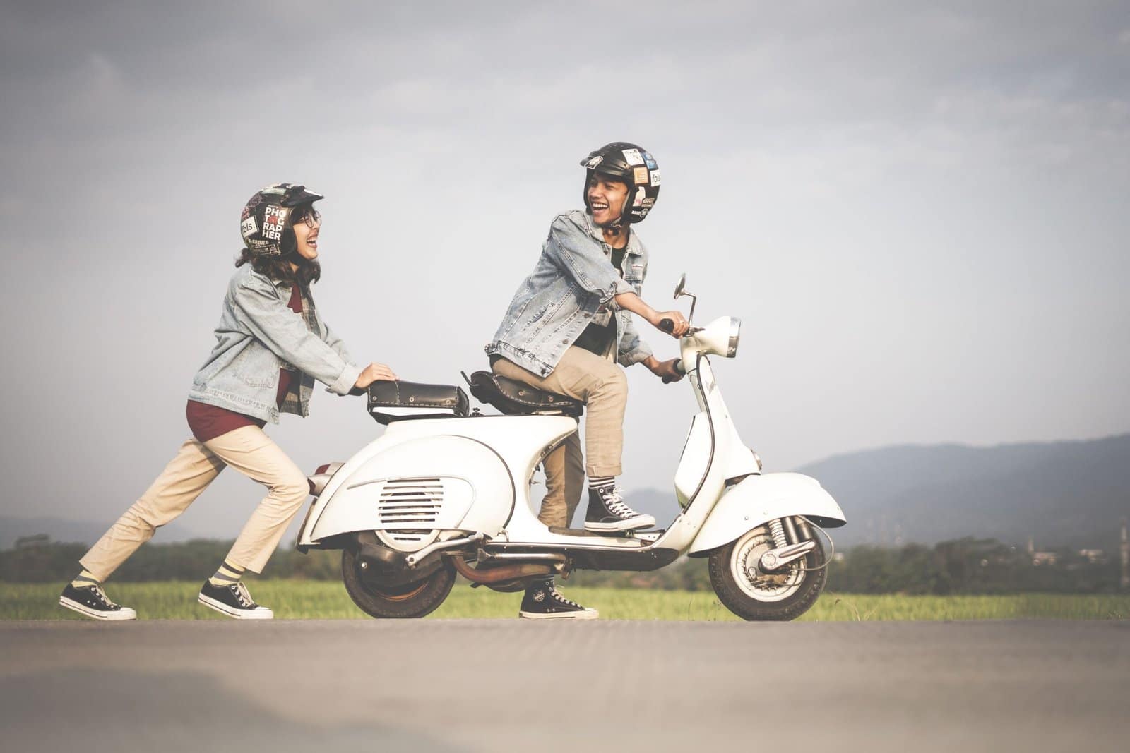 Vintage Scooter Riding Through a Sunny Countryside Lane