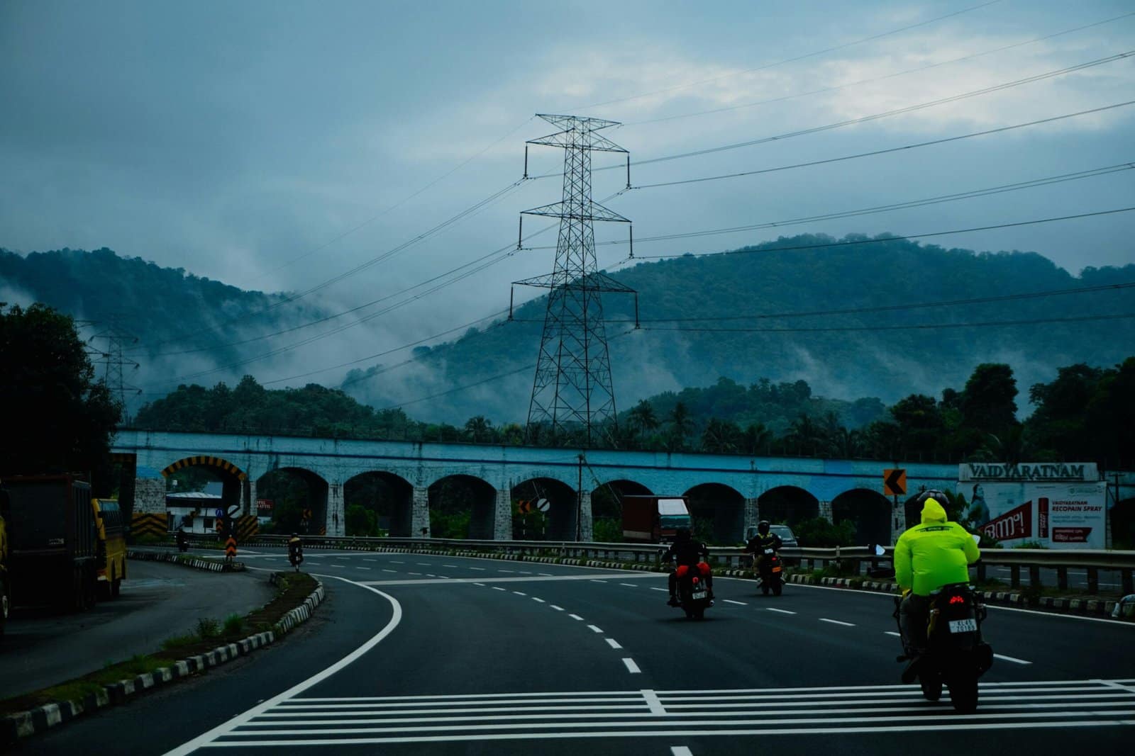Black Adventure Motorcycle Crossing a Mountain Bridge