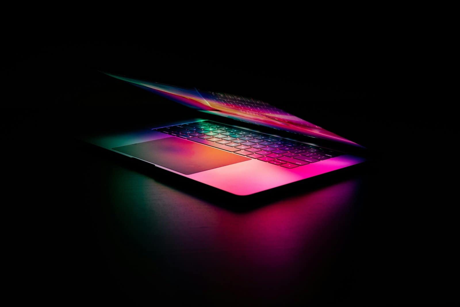 Futuristic Laptop on Desk with Holographic Interface