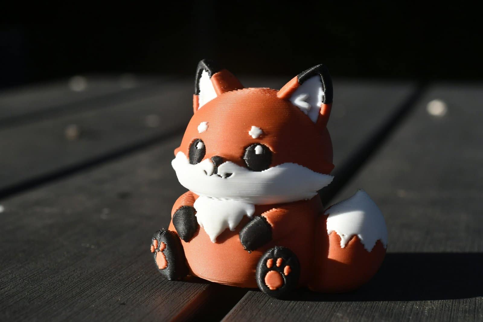 Cute 3D Printed Fox Figurine on Dark Wood