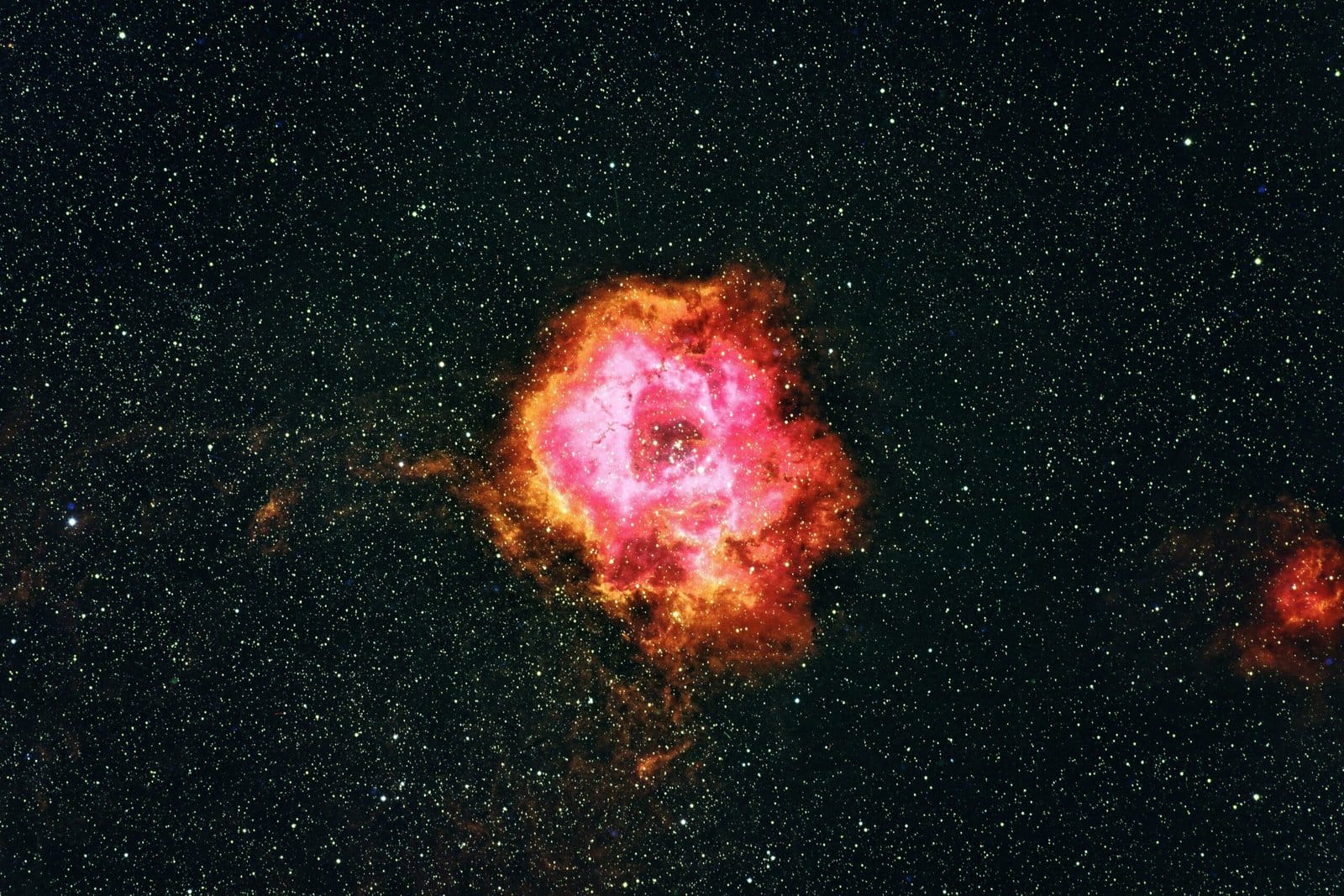 Orange Nebula Clouds Drifting Through Deep Space