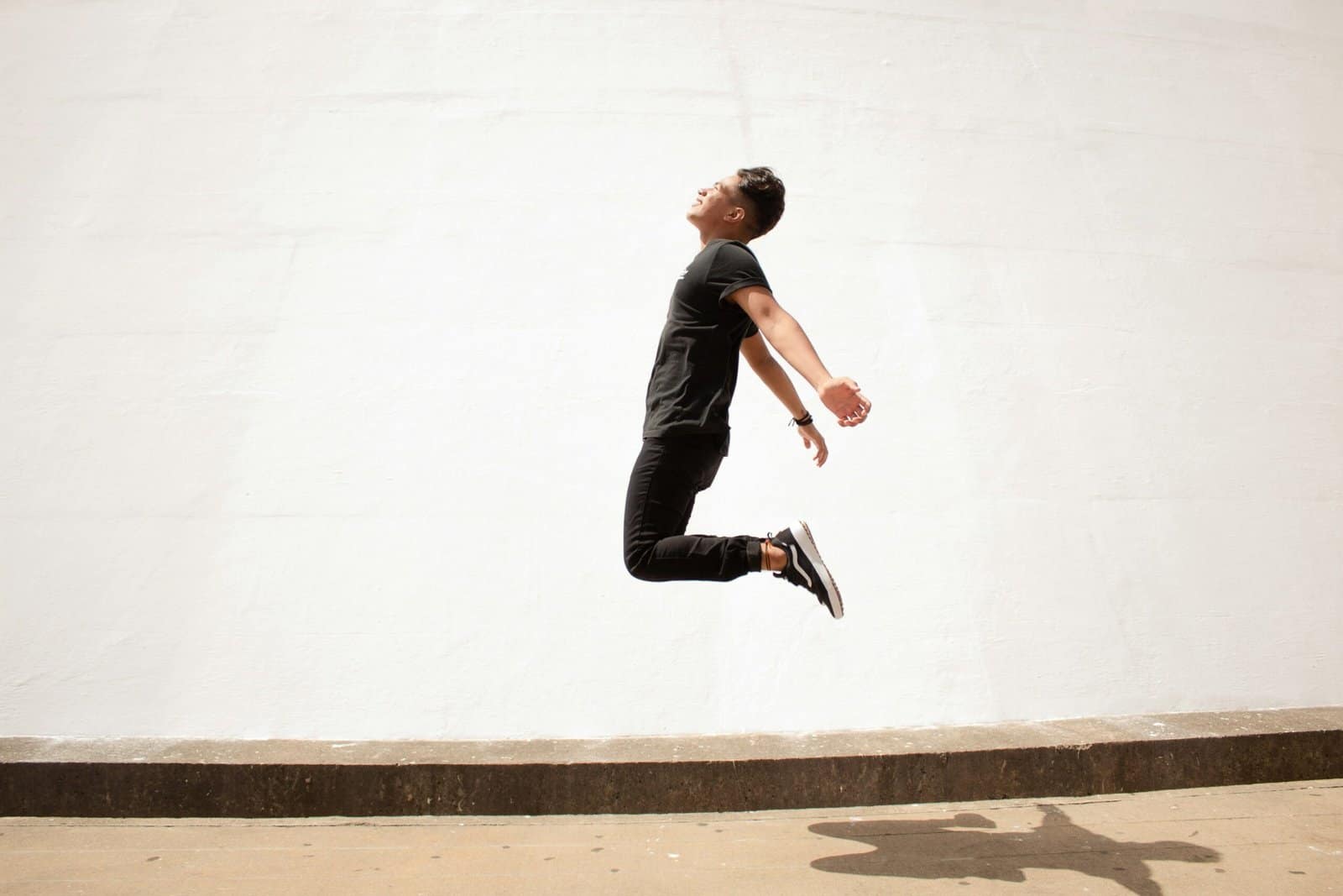 Parkour Athlete Leaping Over Concrete Wall