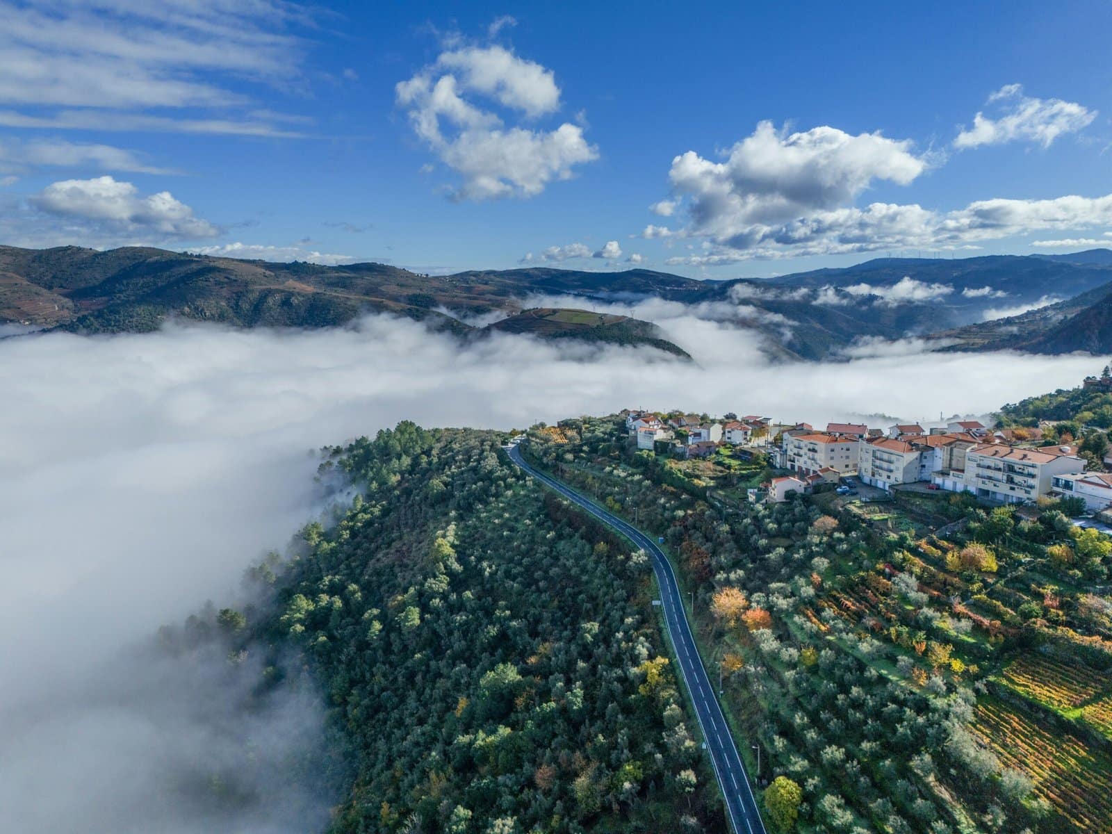 Mystical Floating Village Above a Sea of Clouds