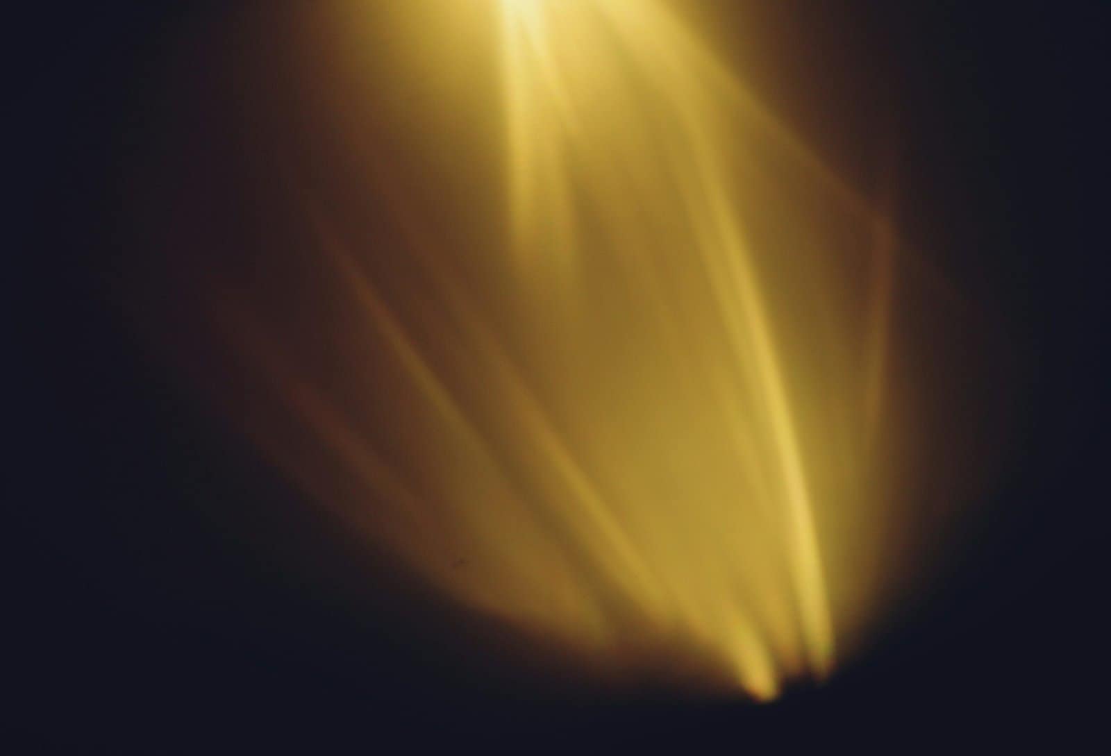 Golden Light Rays Bursting Through Darkness