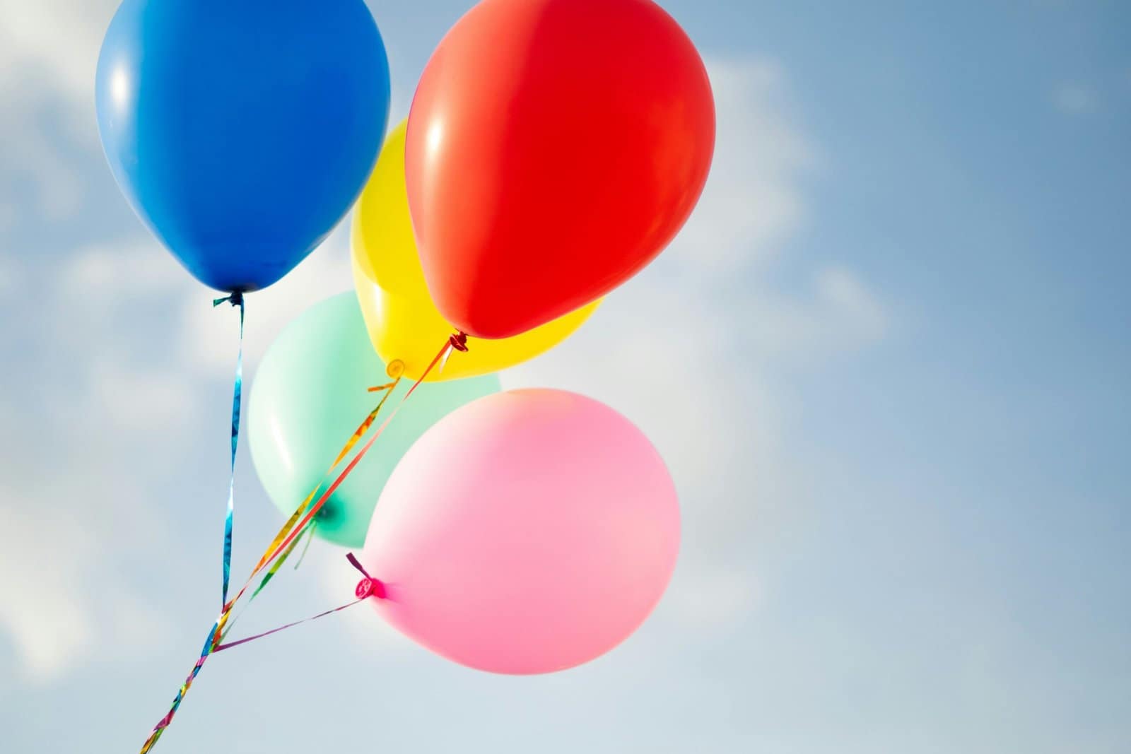 Colorful 3D Balloons Floating in Sky