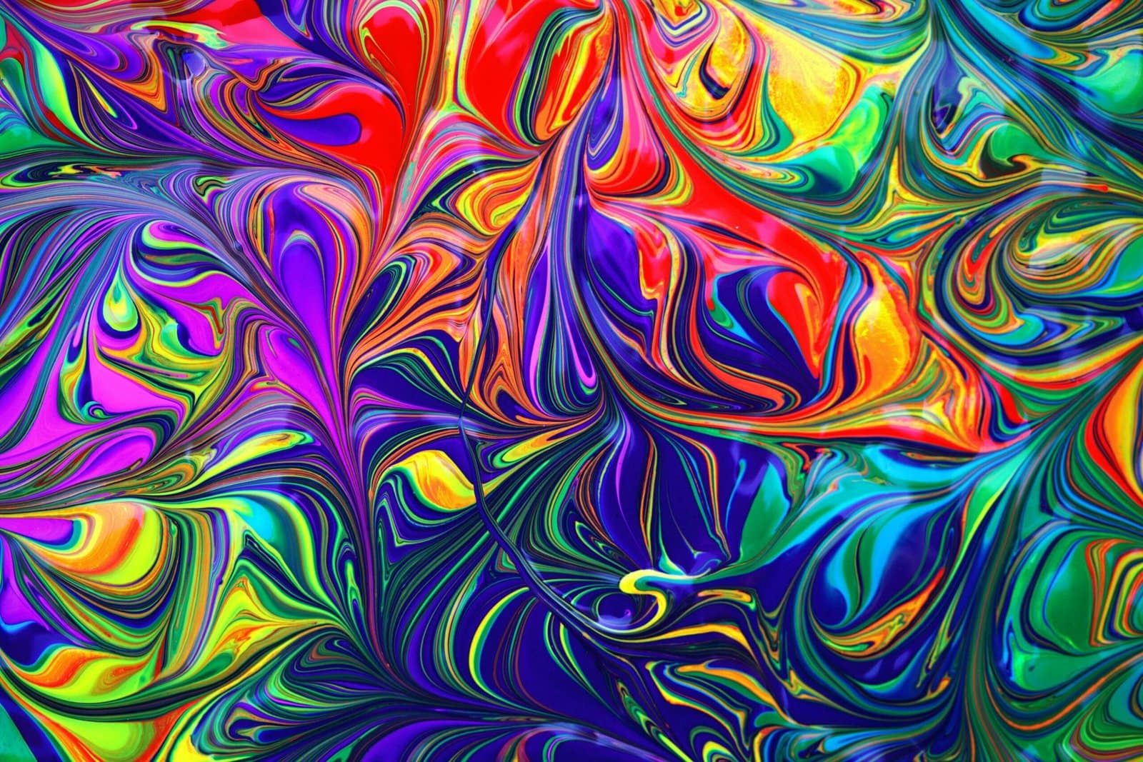 Colorful Paint Swirls Mixing on a White Canvas