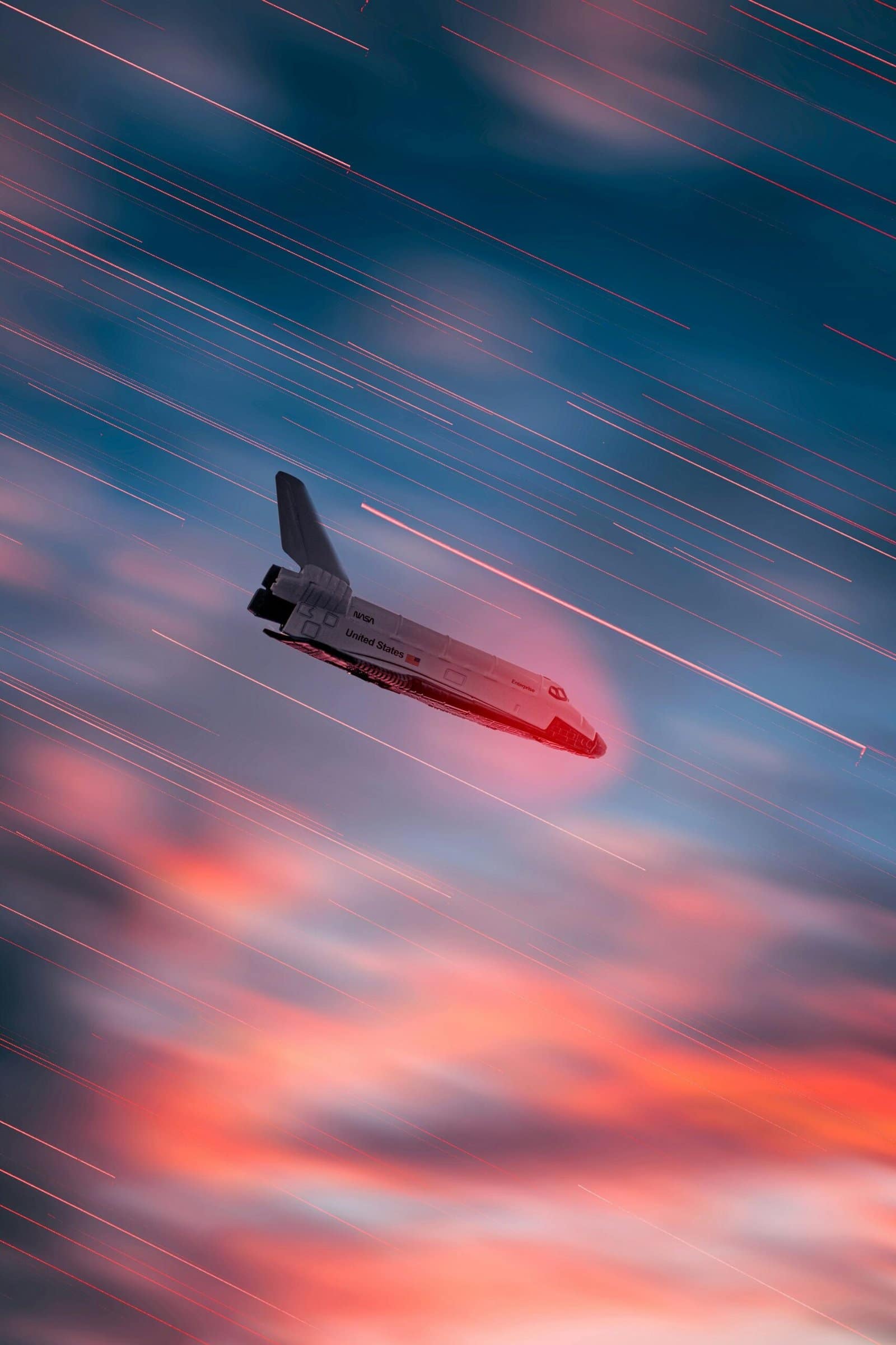 Shiny 3D Spaceship Flying Through Colorful Clouds
