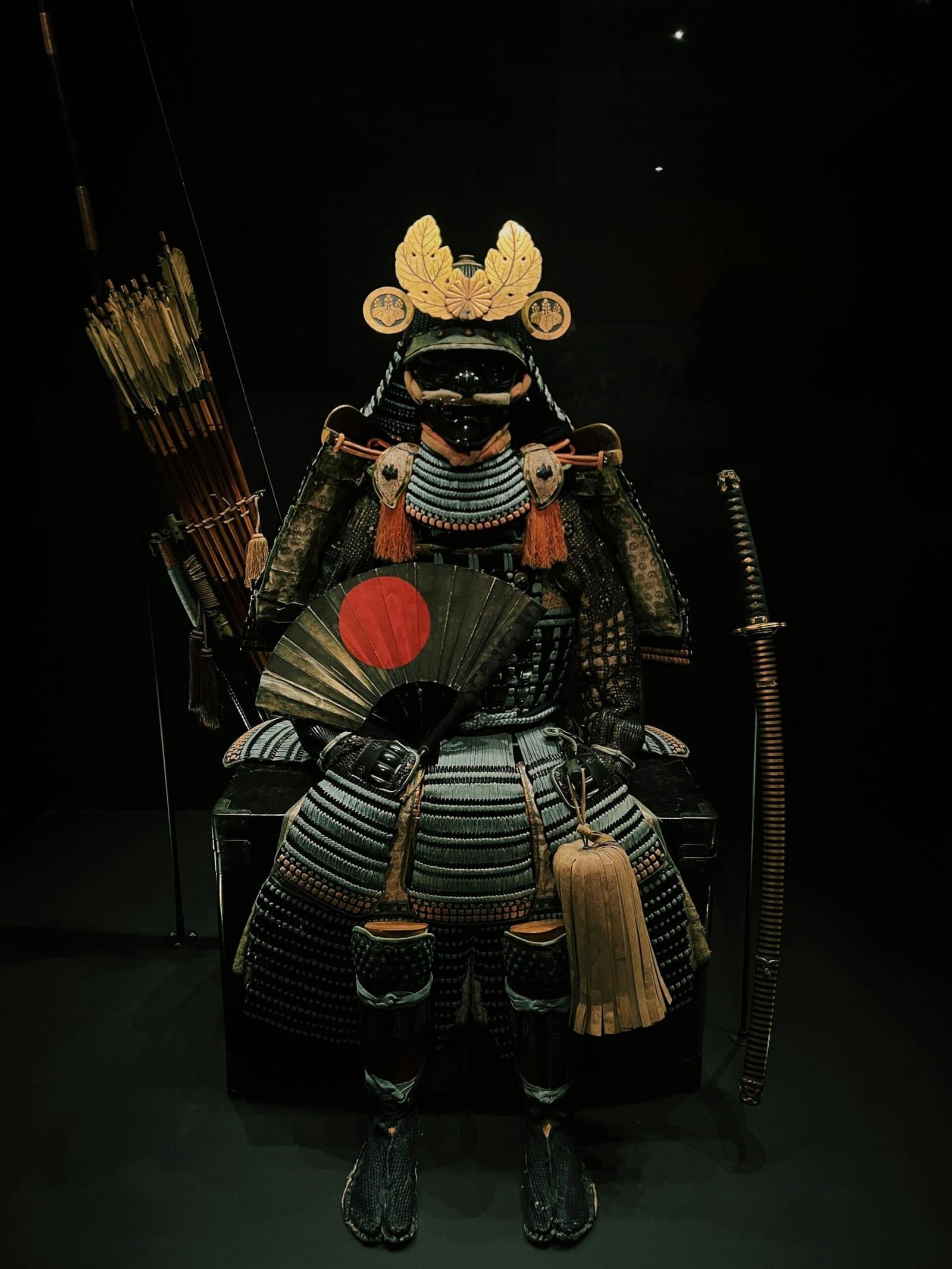 Anime Samurai Sitting on a Chair Holding a Sword