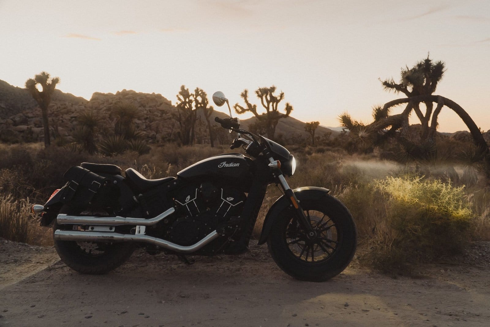 Black Cruiser Motorcycle in Desert at Dawn