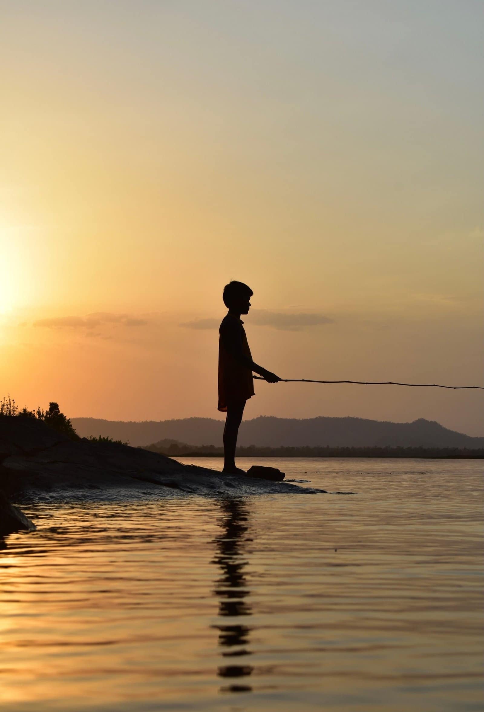 Anime Boy Fishing By Quiet Lake At Sunset