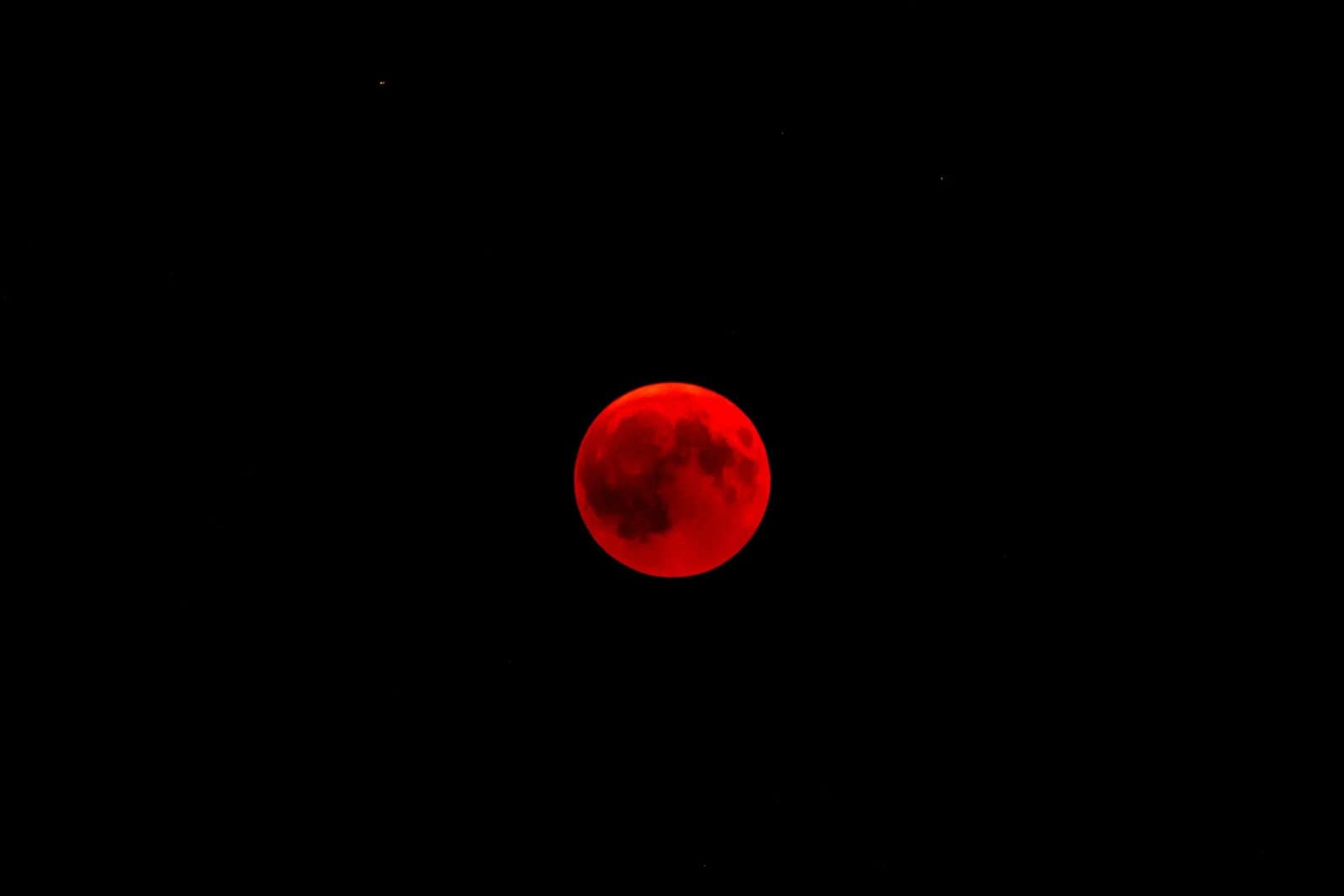 Blood Red Lunar Eclipse Moon in a Dark Night Sky