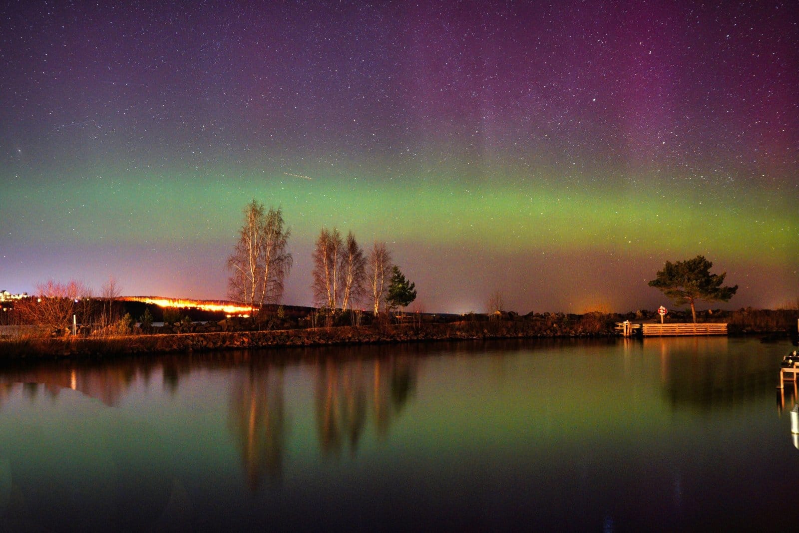 Aurora Borealis over a Glacial Lake with Mirrored Glow