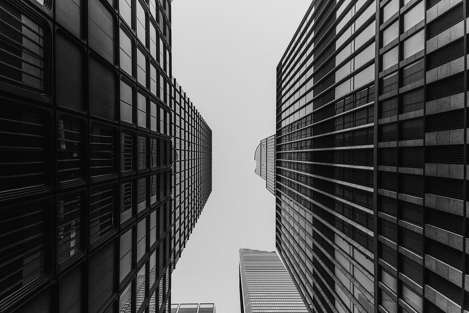 A black and white photo of tall buildings