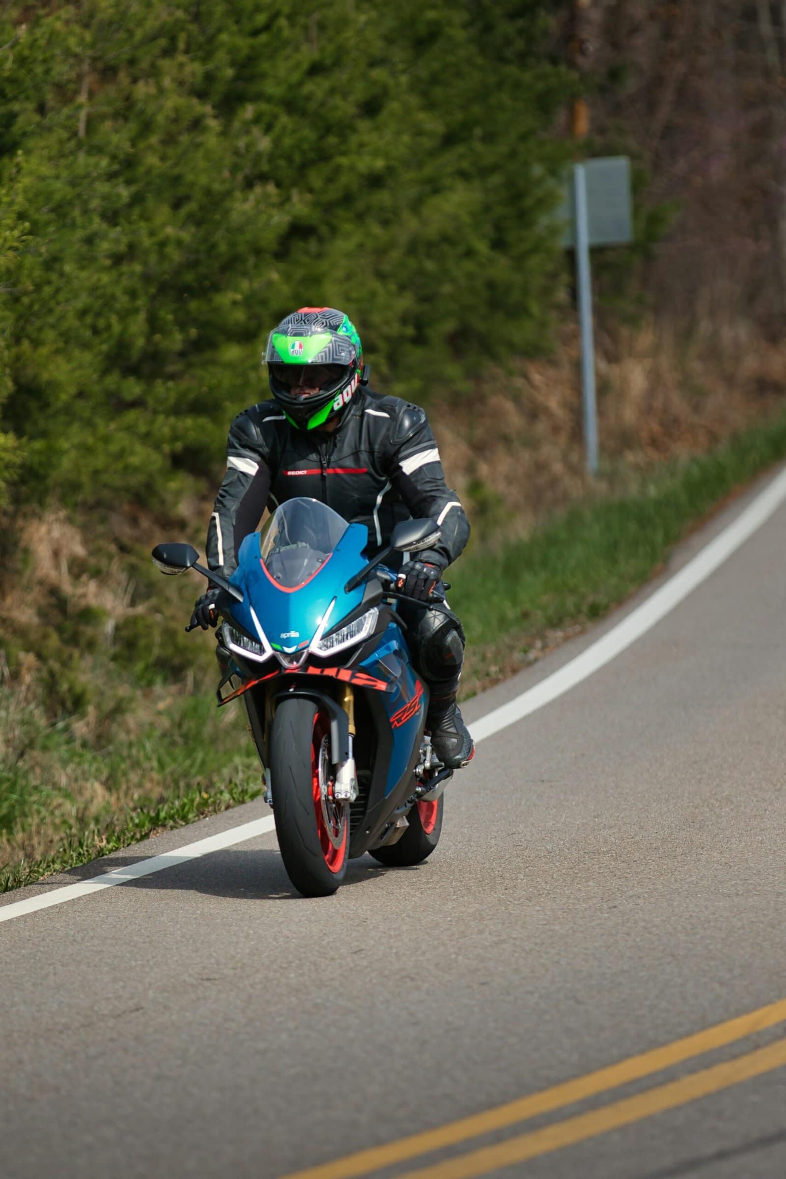 Blue Adventure Motorcycle Riding Through Mountain Pass