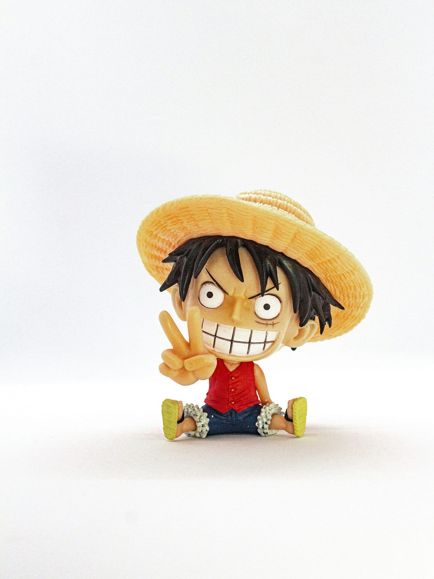 Luffy Sitting with a Cheerful Grin