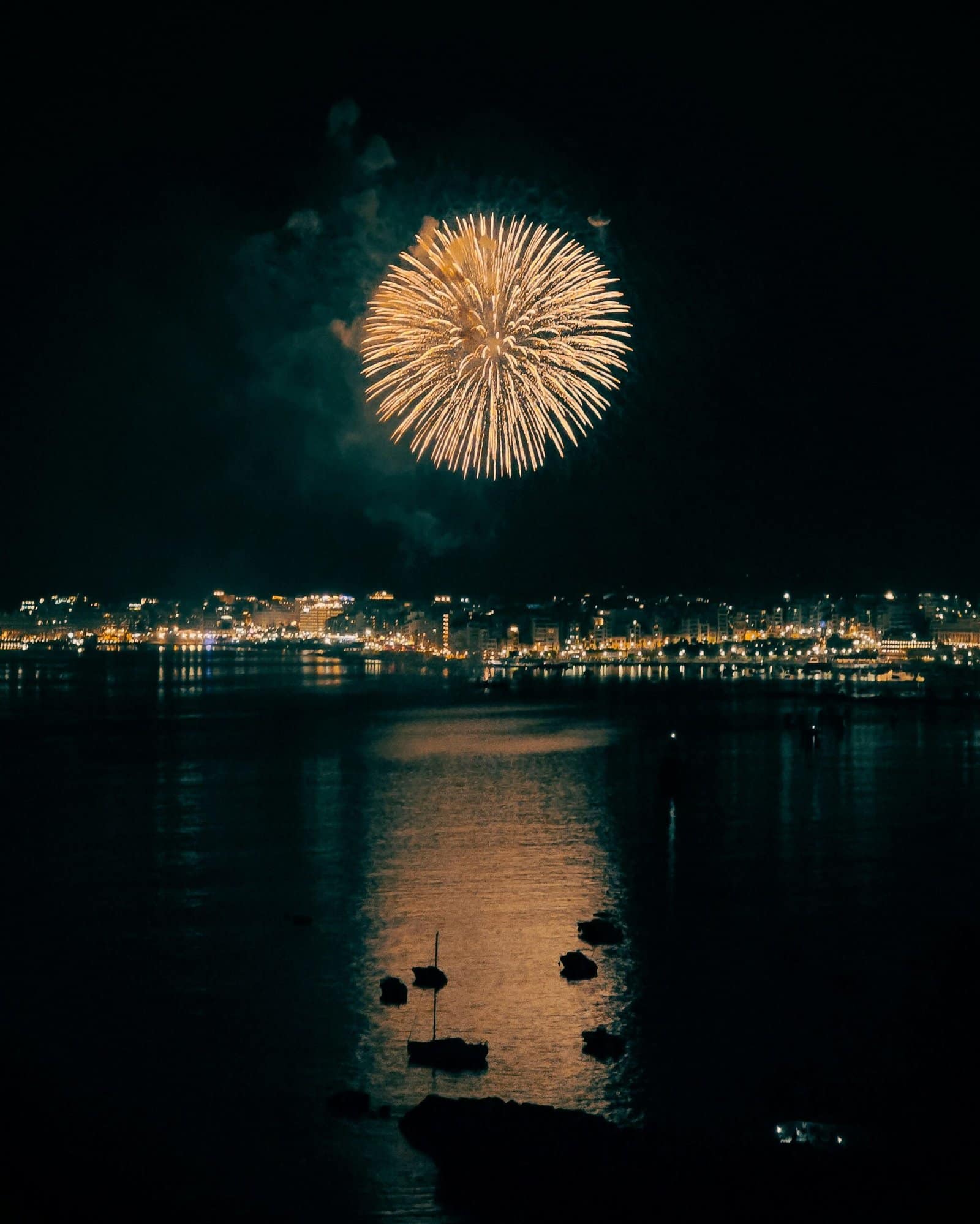 Fireworks Bursting Over City Harbor At Midnight