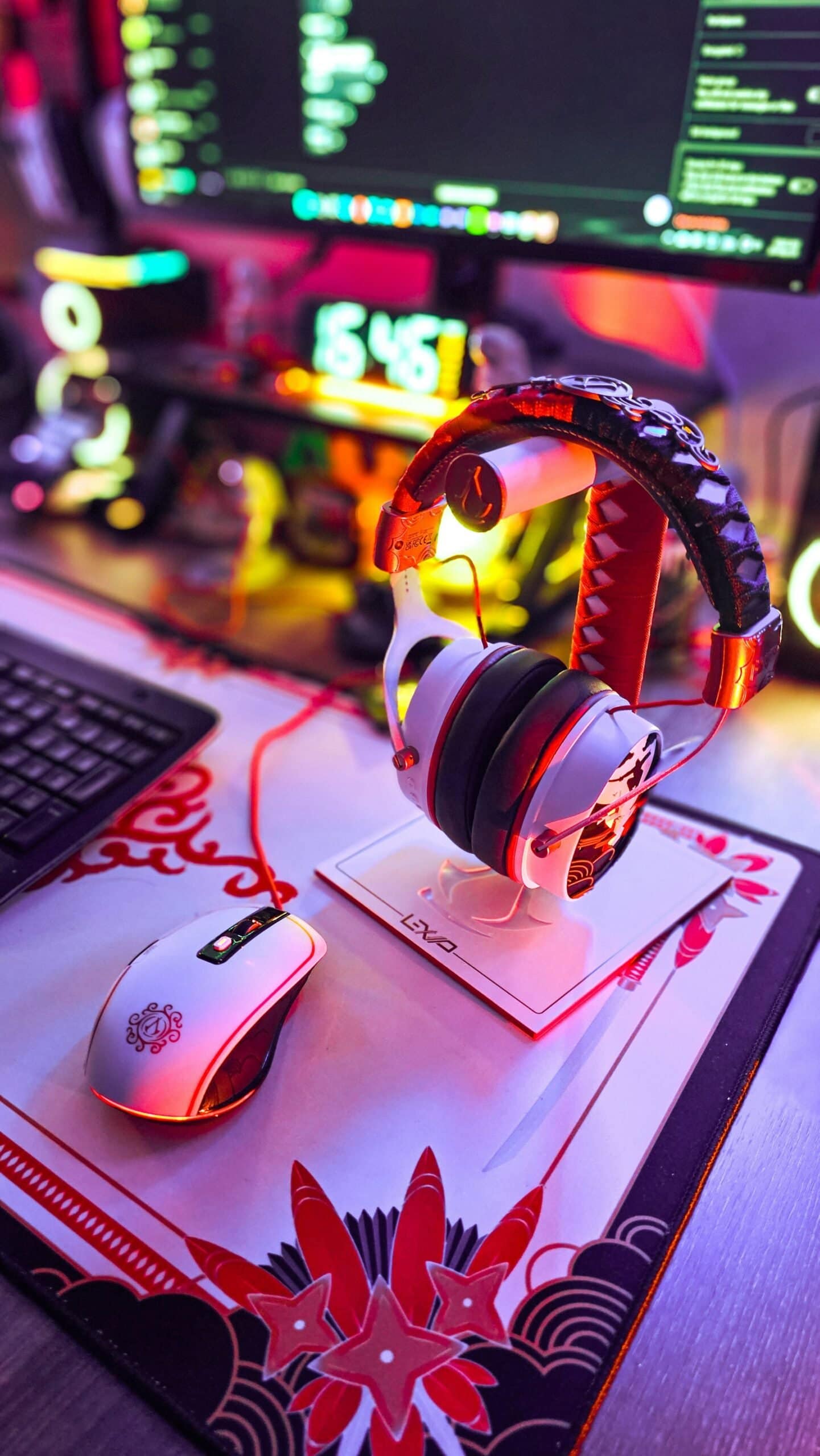 Wireless Headphones Resting On Neon Gaming Desk