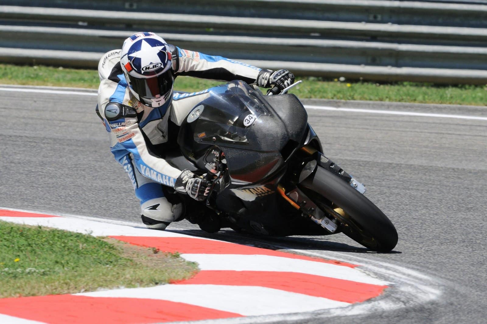 Sport Bike Leaning Into a Curve on a Racetrack