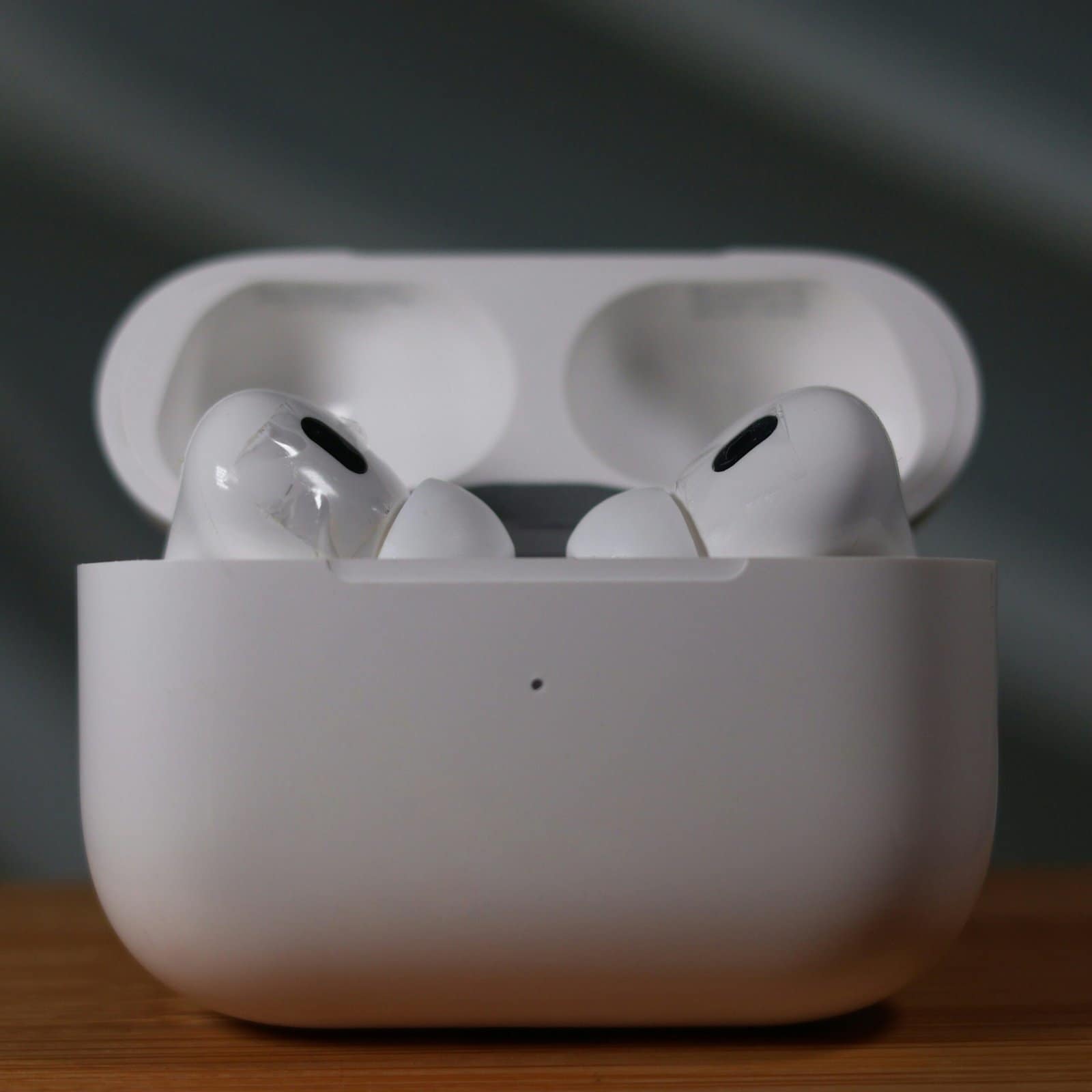 White Wireless Earbuds in an Open Charging Case