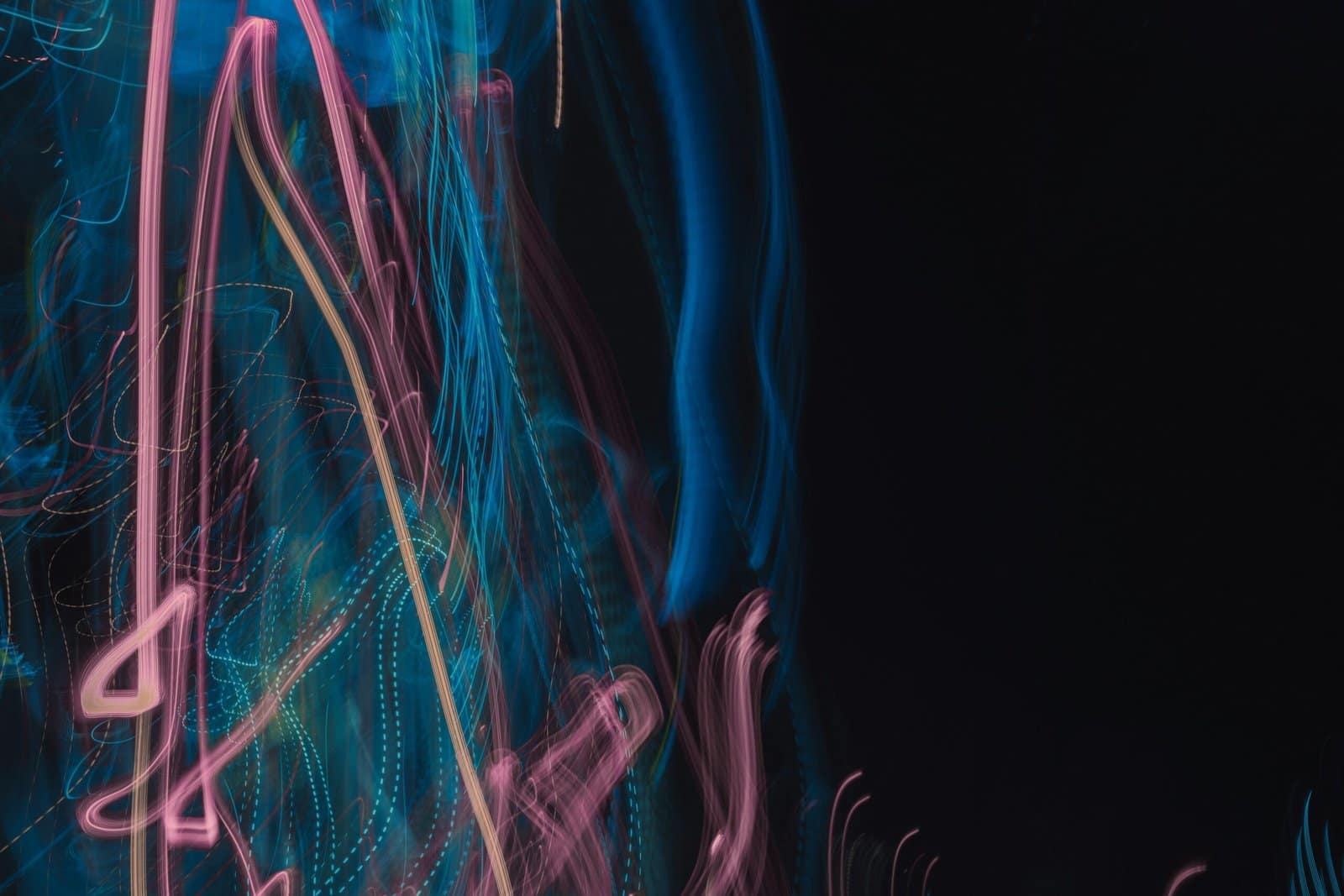 Neon Pink Light Trails Crossing Dark Background